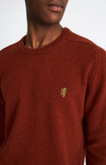 Pringle Round Neck Lion Lambswool Jumper In Red Rust & Mineral Green showing embroidery