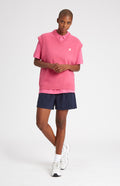 Unisex V Neck Sleeveless Golf Jumper In Heather Pink on female model - Pringle of Scotland