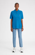 Cotton Heritage Golf Polo Shirt In Lagoon on female model full length - Pringle of Scotland