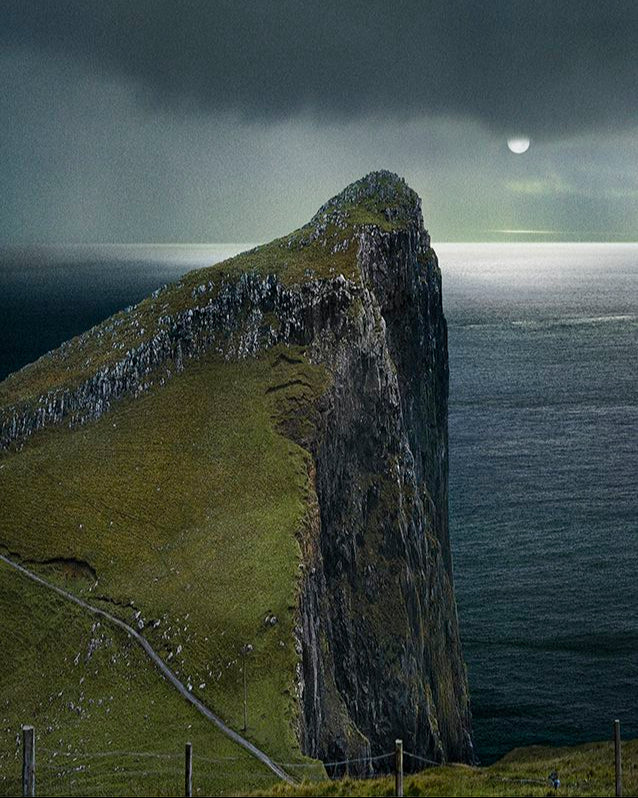Storr, a prominent rocky outcrop on the Isle of Skye, Scotland, with a dramatic sky.