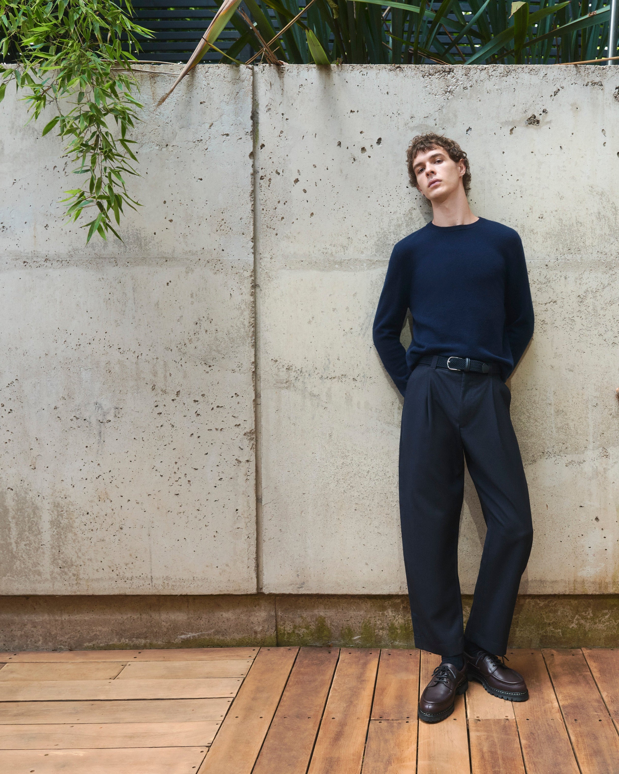 Model wearing Pringle of Scotland Cashmere Crew Neck Standing against concrete wall