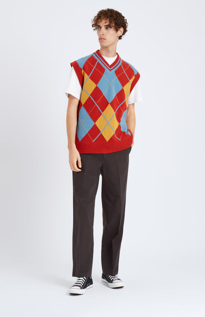 Pringle Lambswool Argyle V Neck Vest in Royal Blue & Rust Red on model full length