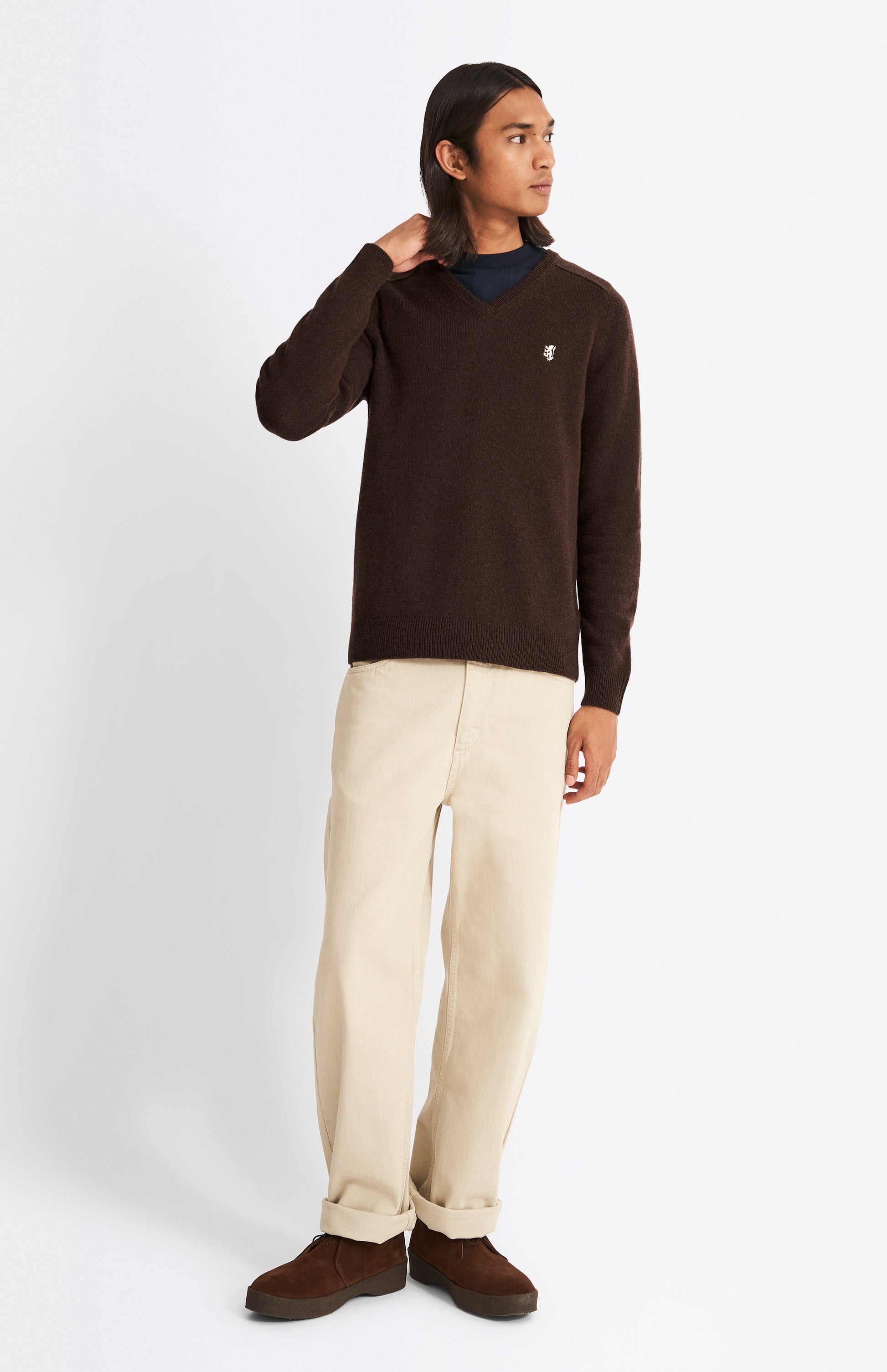 Pringle V Neck Lambswool Jumper in Dark Umber with Contrast Tipping on model full length