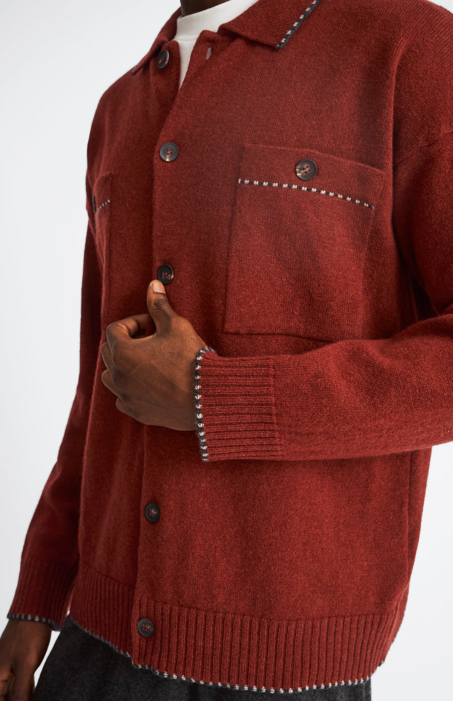 Knitted Lambswool Overshirt With Contrast Edging In In Rust Red & Cobble showing pocket detail