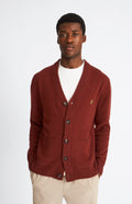 Pringle Men's lambswool V Neck Cardigan in Red Rust & Mineral Green on model