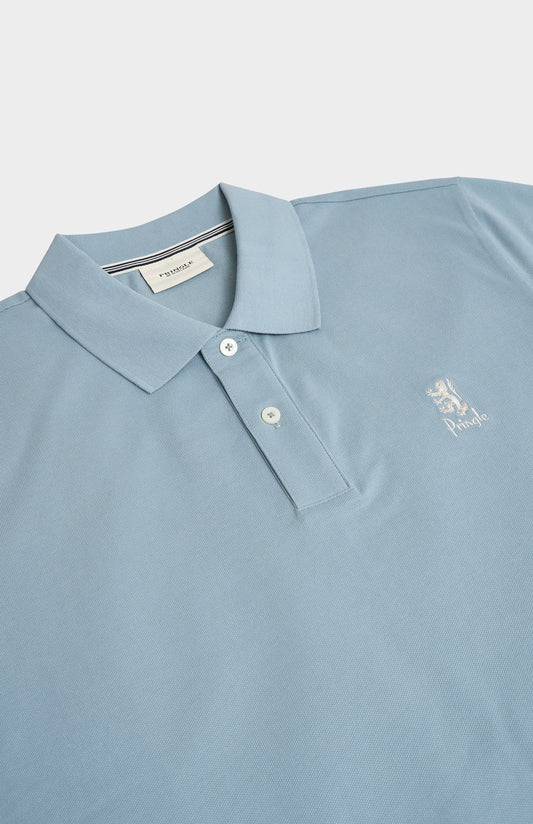 Light blue polo shirt with a logo on a light gray background