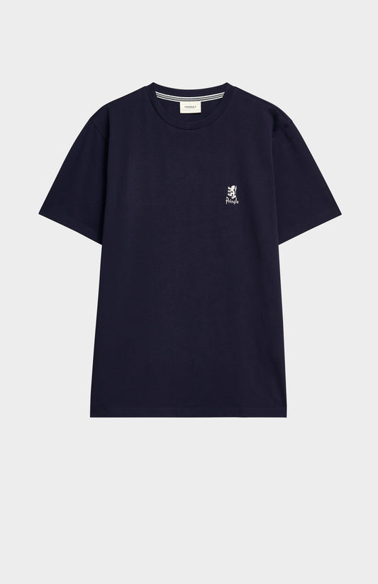 Navy blue t-shirt with a small logo on a light gray background