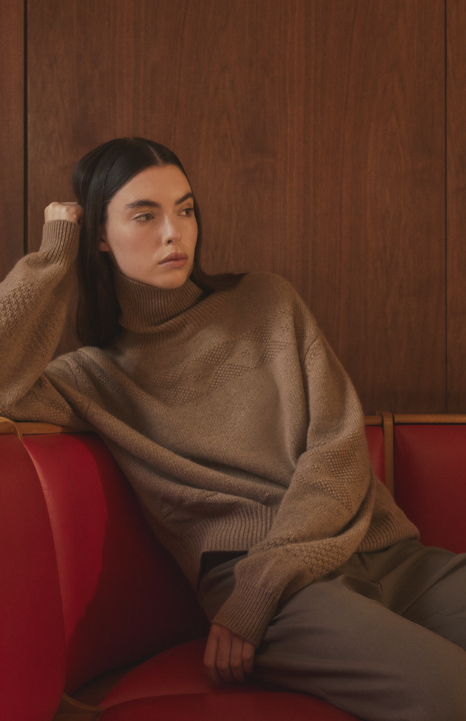 Woman wearing a Pringle of Scotland roll neck cashmere jiumper