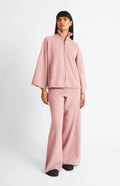 Pringle Cashmere Blend High Neck Zip Thru Jacket in Dusty Pink on model with matching trousers