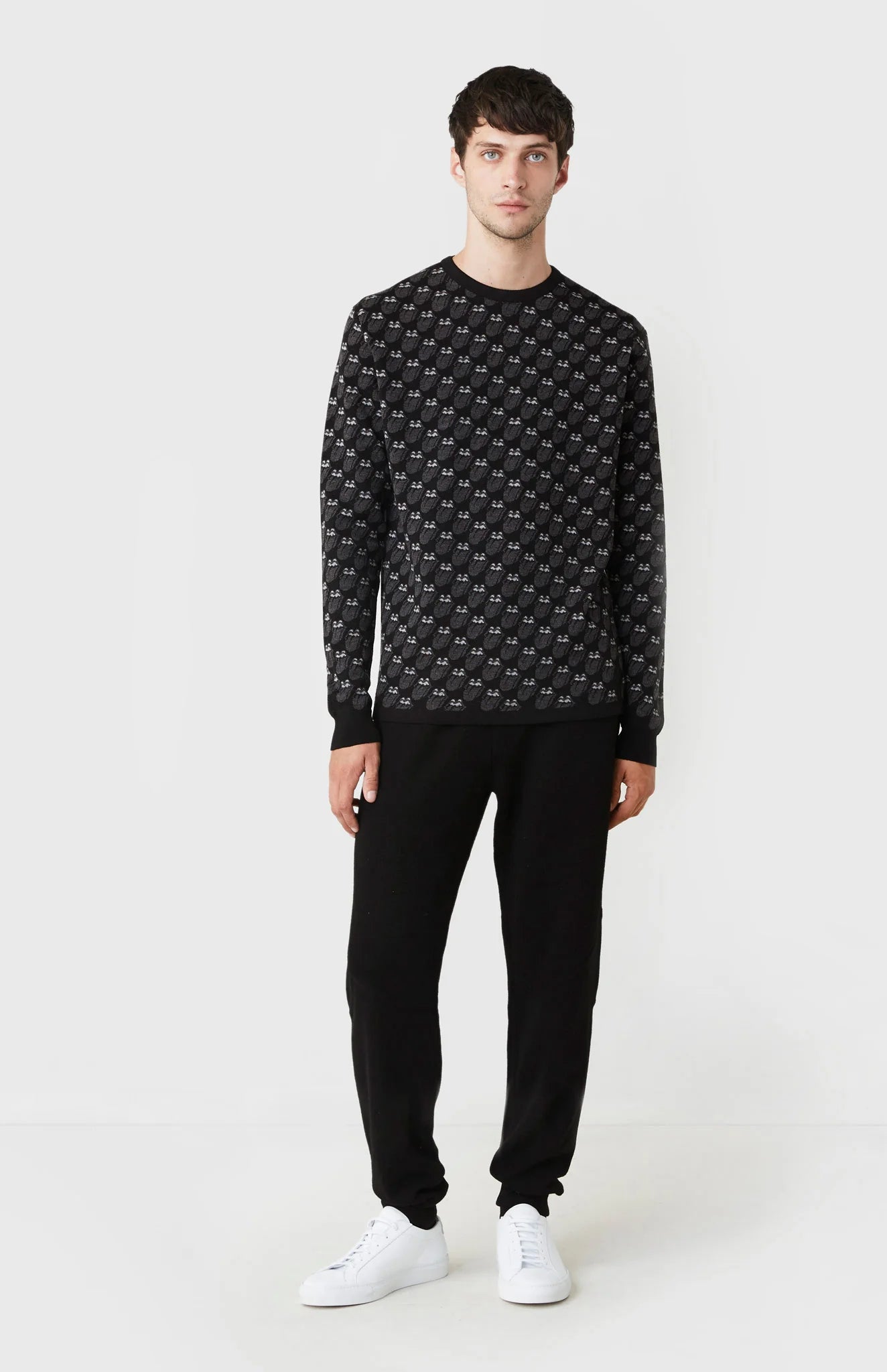 Man wearing a patterned cashmere jumper from the Pringle of Scotland Rolling Stones collection