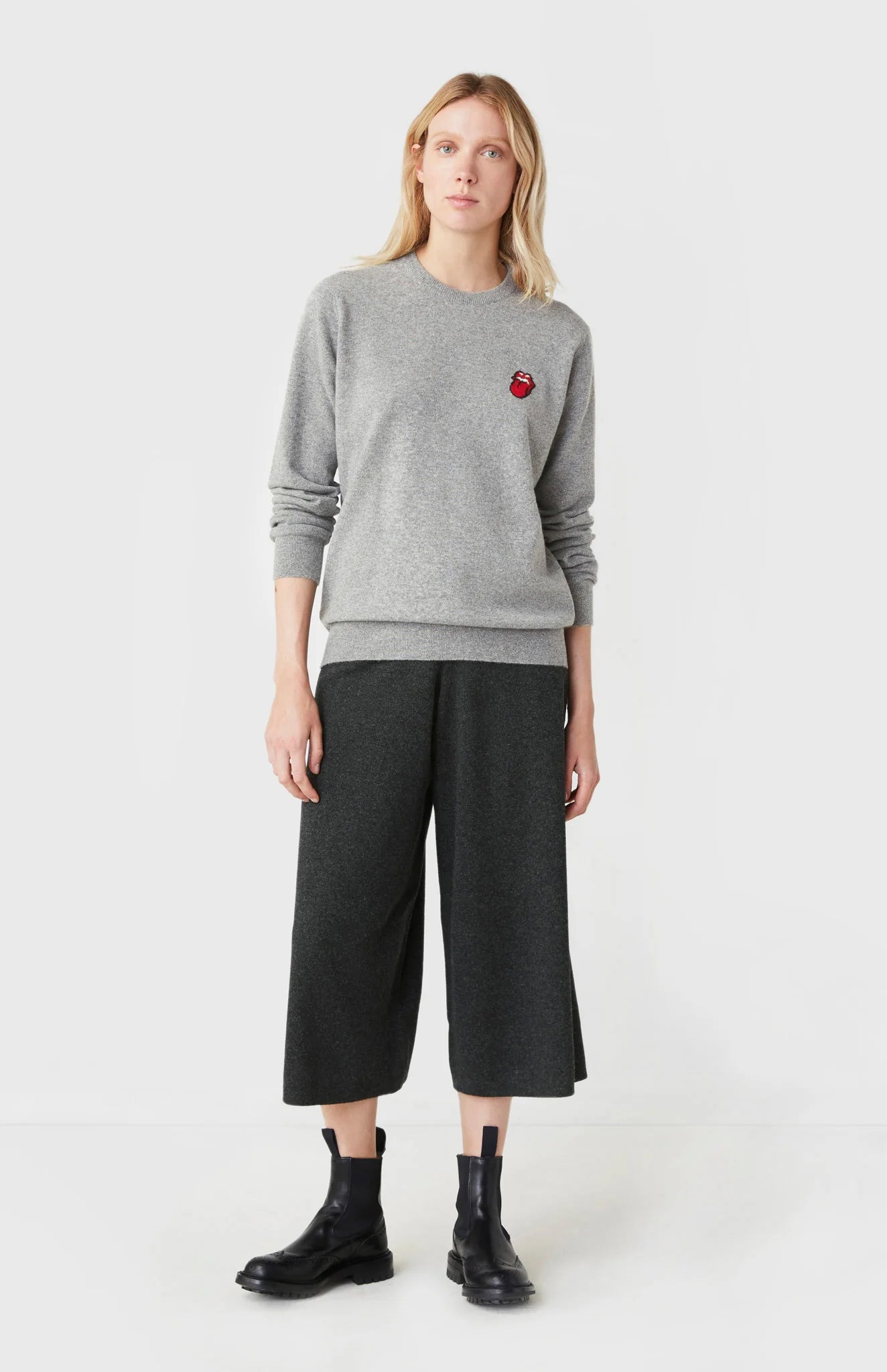 Woman wearing a cashmere jumper from the Pringle of Scotland Rolling Stones collection