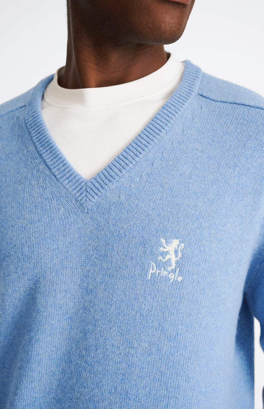 Pringle of Scotland Archive Men's V neck Lambswool Jumper In Carolina Blue showing embroidery