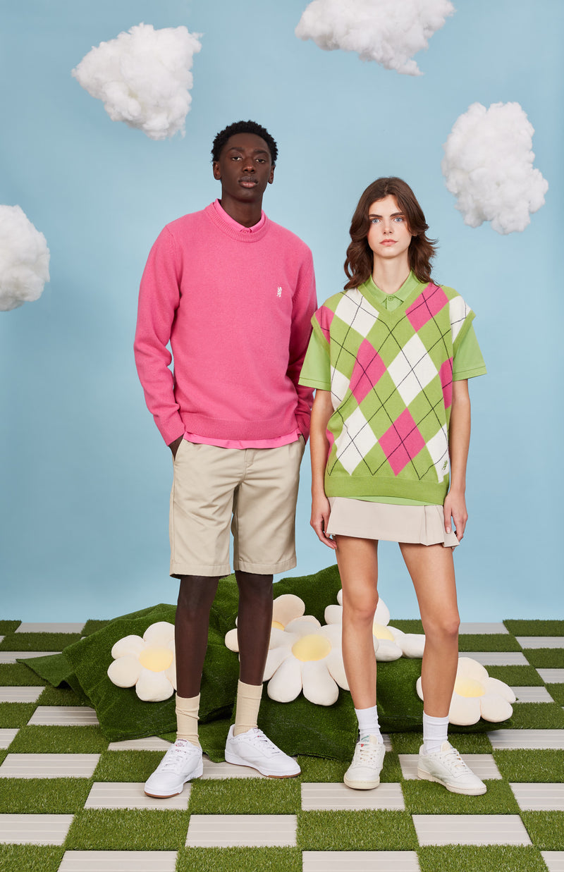 Two models wear Pringle of Scotland new season golf knitwear in pink and green