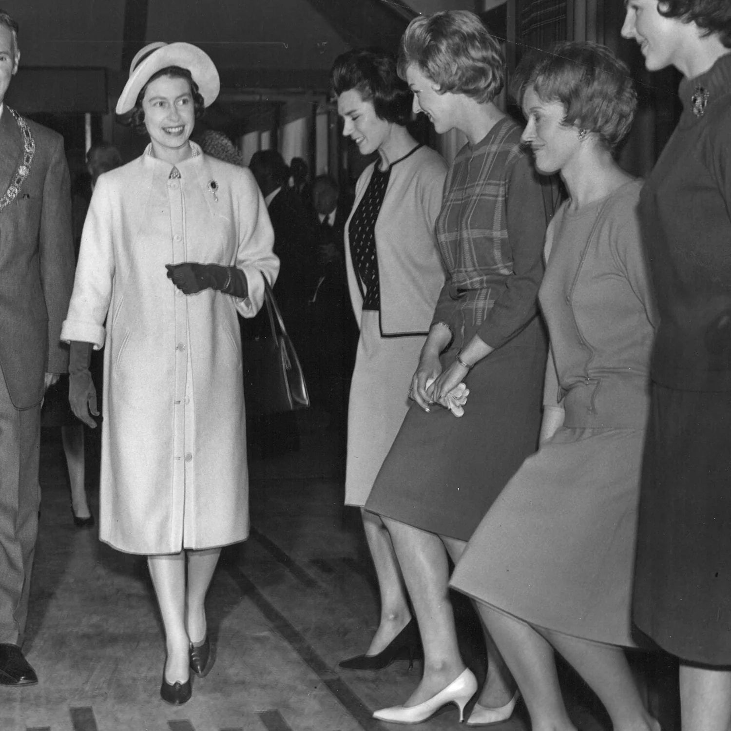 Queen Elizabeth II meeting Pringle of Scotland staff