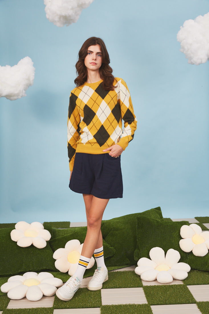 Unisex heritage argyle golf jumper in Mustard & Ivory on female model - Pringle of Scotland 