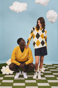 Unisex heritage argyle golf sleeveless jumper in Ivory & Mustard on model - Pringle of Scotland