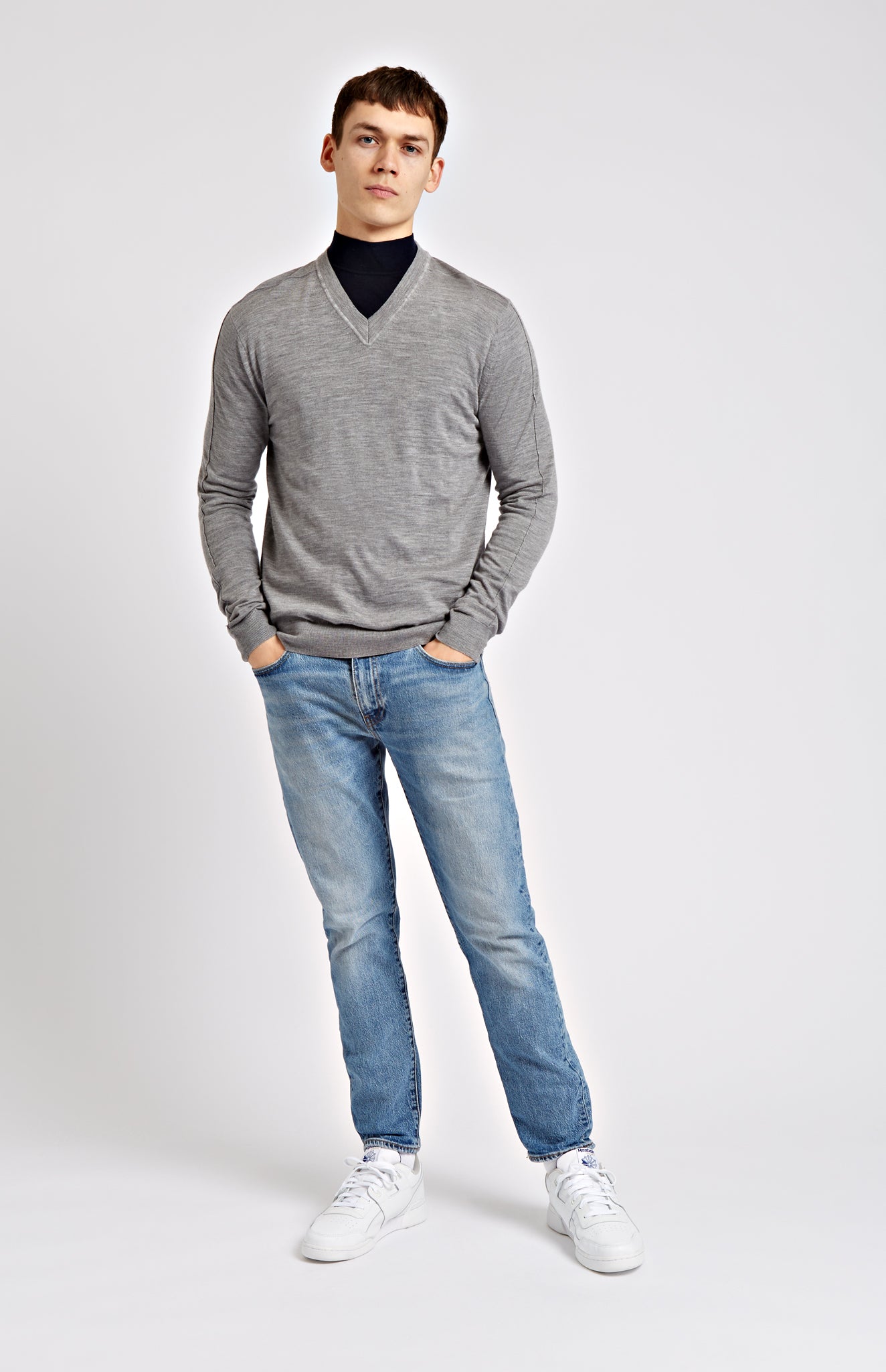 Men's V Neck Merino Wool Jumper In Light Grey Melange on model full length - Pringle of Scotland