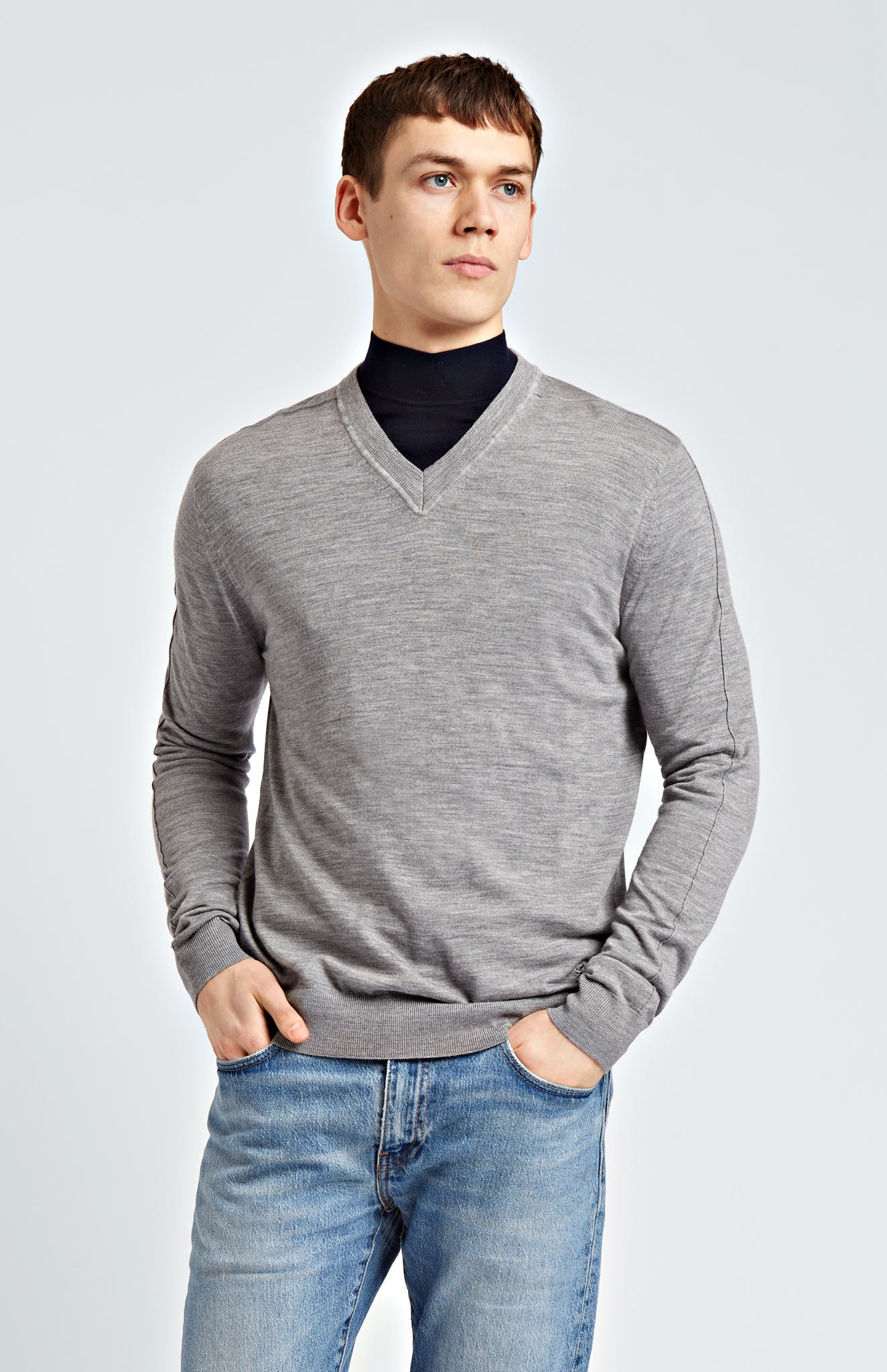 Men's V Neck Merino Wool Jumper In Light Grey Melange on model - Pringle of Scotland