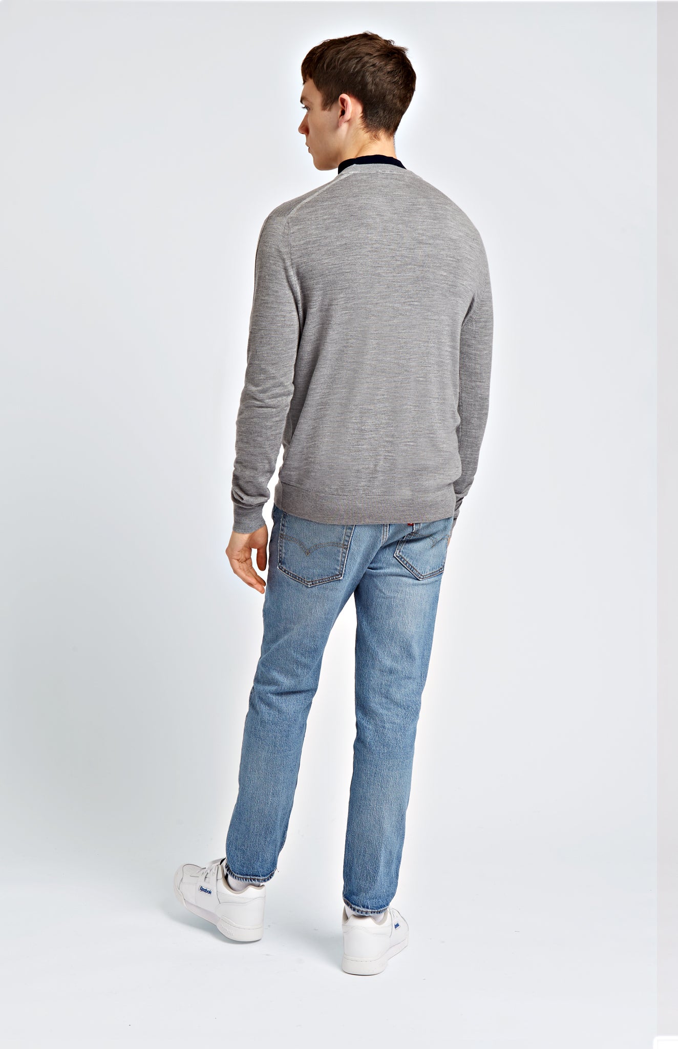 Men's V Neck Merino Wool Jumper In Light Grey Melange on model rear shot - Pringle of Scotland