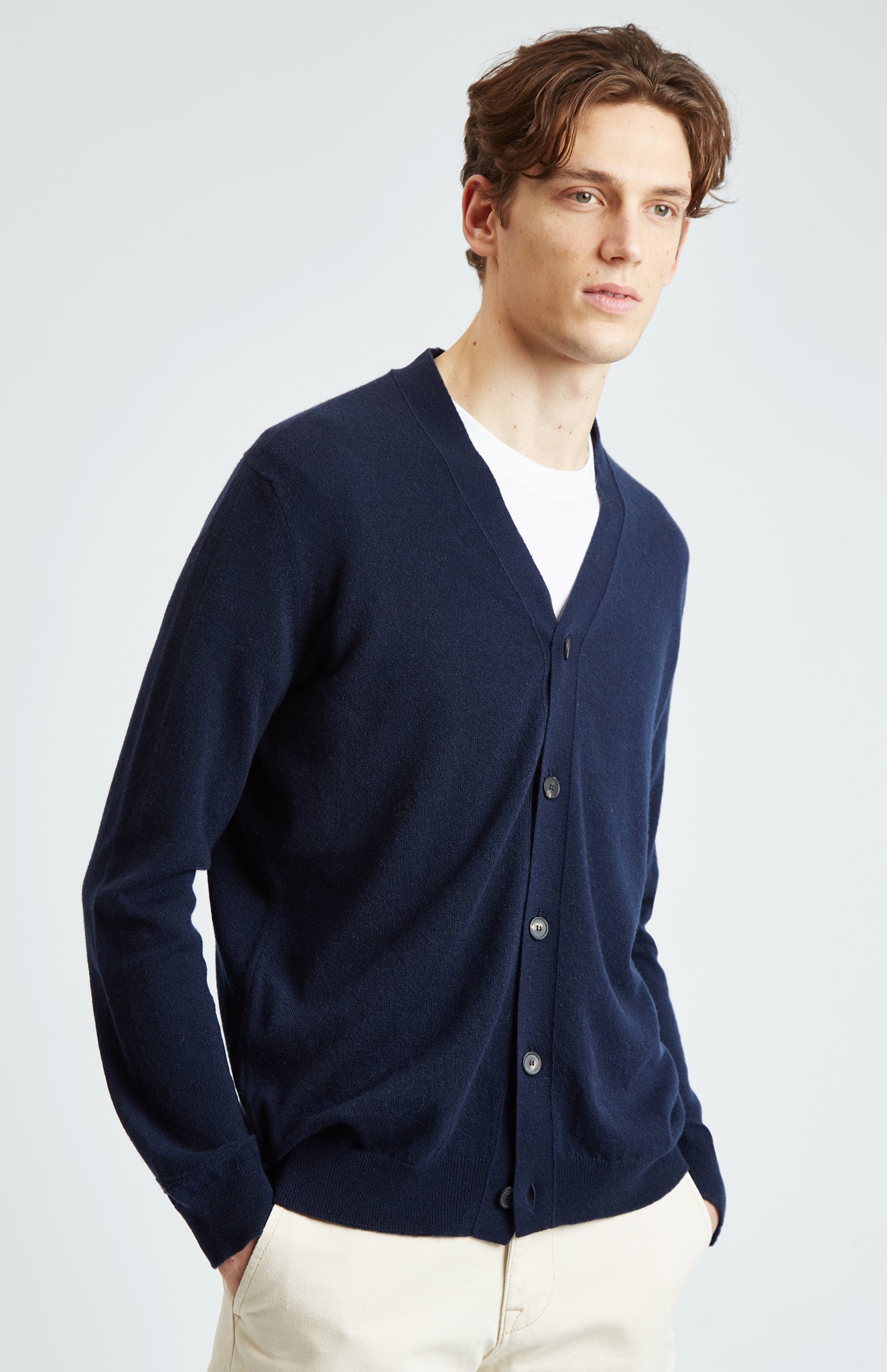 Prinlge of Scotland Men's Classic Cashmere Cardigan in Navy. Cropped Front View on model