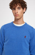 Round Neck Lion Lambswool Jumper In Blue Oxide close up - Pringle of Scotland