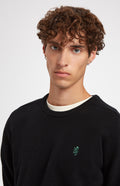 Round Neck Lion Lambswool Jumper In Black/Evergreen showing neck detail - Pringle of Scotland