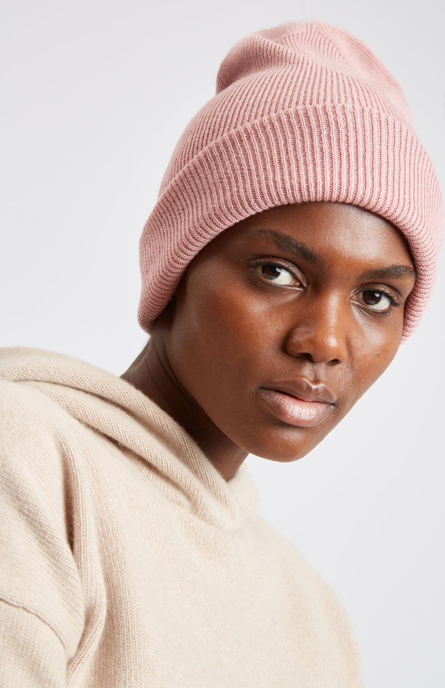 Double Layer Ribbed Merino Beanie in Fondant Pink on model - Pringle of Scotland