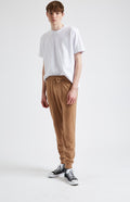 Men's Knitted Merino Cashmere Joggers in Vicuna on model - Pringle of Scotland