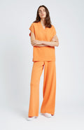 V Neck Sleeveless cashmere blend jumper in Orange on model full length - Pringle of Scotland