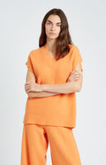V Neck Sleeveless cashmere blend jumper in Orange on model - Pringle of Scotland