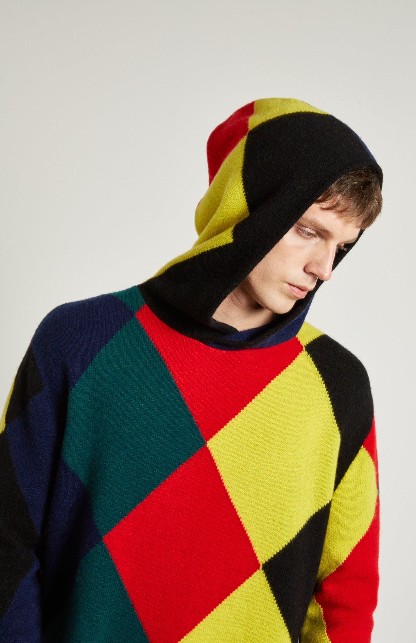 Pringle Reissued Unisex Harlequin Argyle Hoodie on male model with hood up