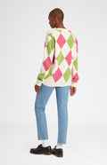 Heritage argyle golf jumper in Ivory & Heather on female model rear view - Pringle of Scotland 