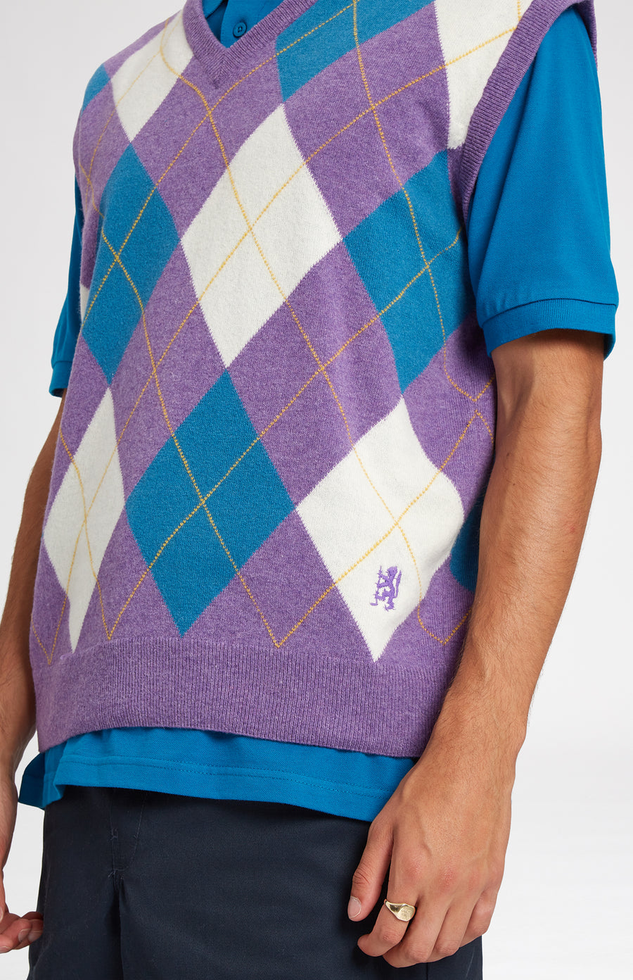 Heritage argyle golf sleeveless jumper in Purple & Ivory embroidery close up - Pringle of Scotland 