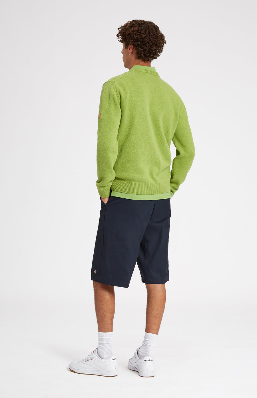 Unisex heritage diamond motif golf jumper in Green and Ivory on male model - Pringle of Scotland