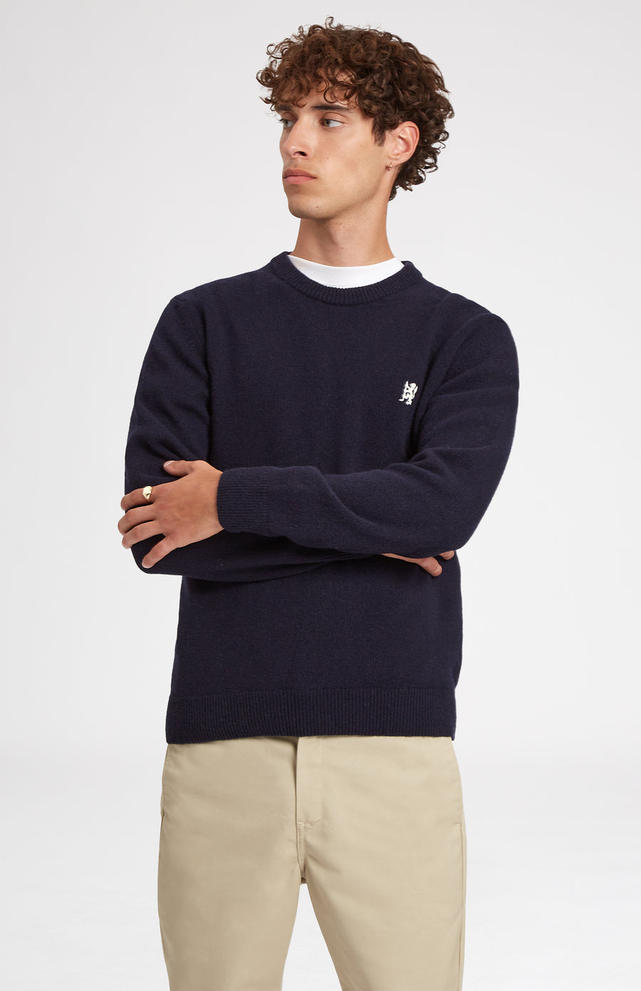 Round Neck Lambswool Golf Jumper In Navy on male model close up - Pringle of Scotland