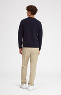 Round Neck Lambswool Golf Jumper In Navy on male model rear view - Pringle of Scotland