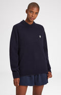 Round Neck Lambswool Golf Jumper In Navy on female model close up - Pringle of Scotland