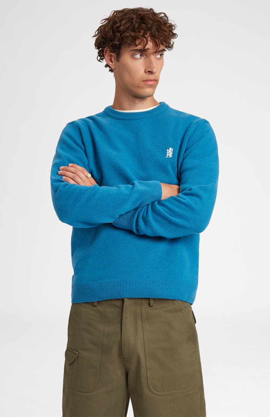 Round Neck Lambswool Golf Jumper In Lagoon on male model - Pringle of Scotland