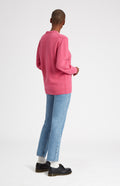 Round Neck Lambswool Golf Jumper In Heather Pink on female model rear view - Pringle of Scotland