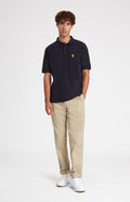 Cotton Heritage Golf Polo Shirt In Navy on male model full length - Pringle of Scotland