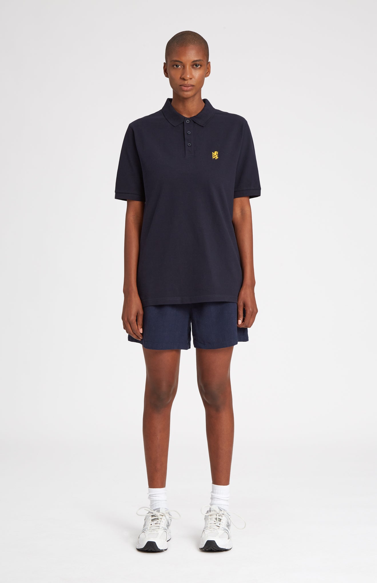 Cotton Heritage Golf Polo Shirt In Navy on female model full length - Pringle of Scotland