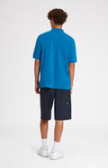 Cotton Heritage Golf Polo Shirt In Lagoon on male model rear view - Pringle of Scotland