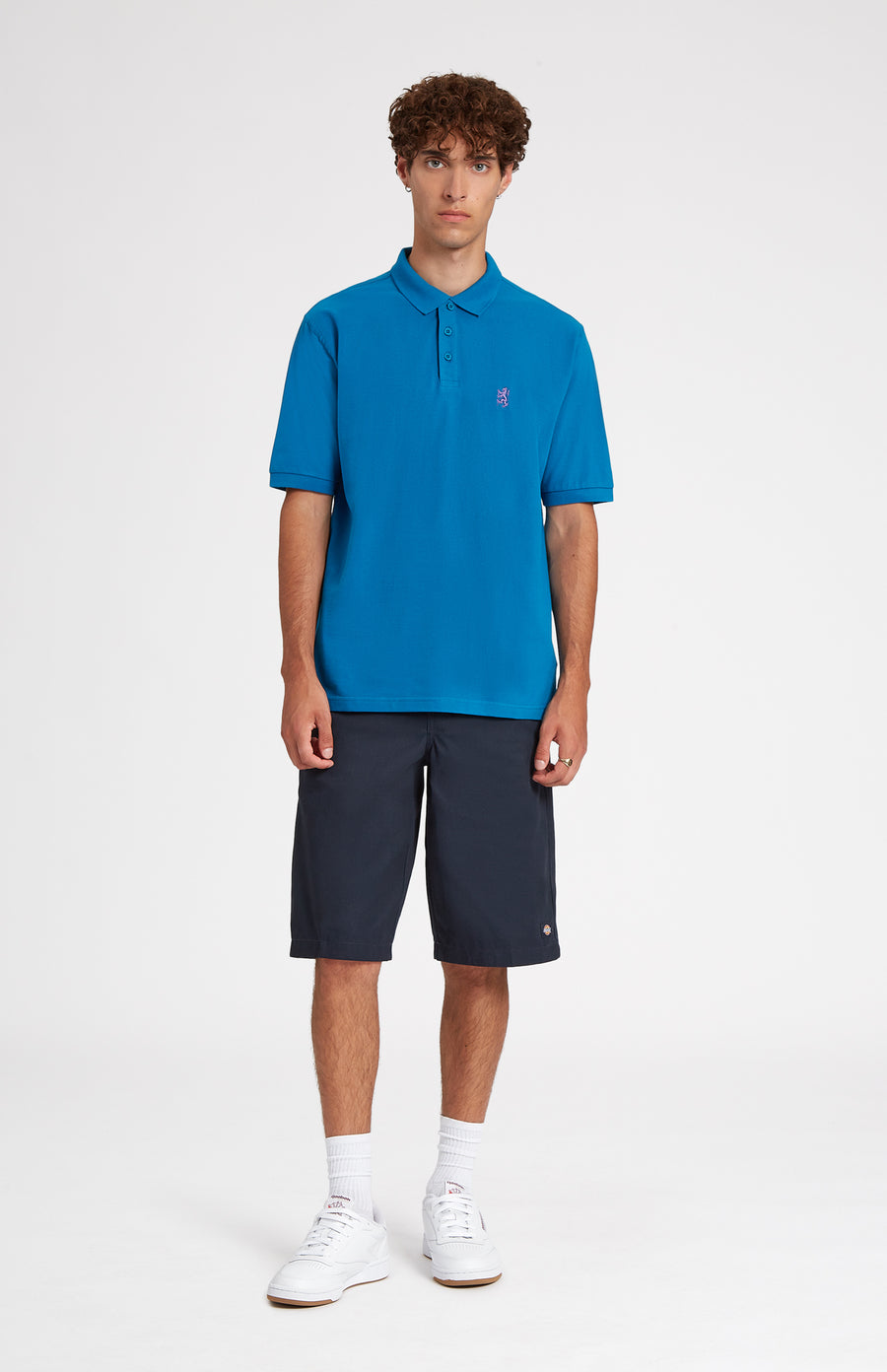 Cotton Heritage Golf Polo Shirt In Lagoon on male model full length - Pringle of Scotland