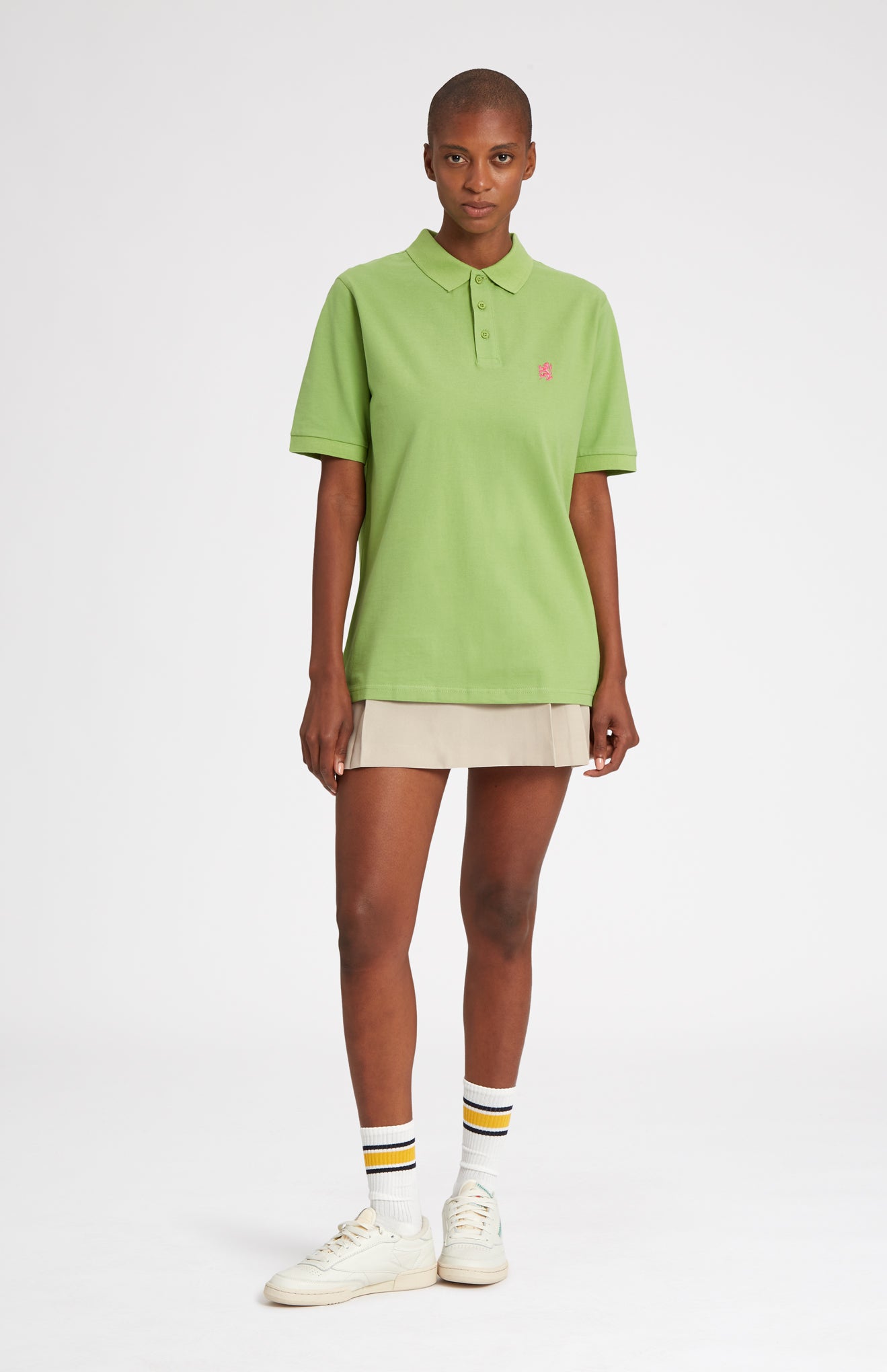 Cotton Heritage Golf Polo Shirt In Field Green on female model full length - Pringle of Scotland