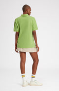 Cotton Heritage Golf Polo Shirt In Field Green on female model rear view - Pringle of Scotland