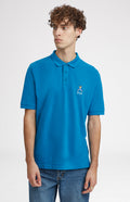 Geometric George Golf Cotton Polo Shirt In Lagoon on model - Pringle of Scotland