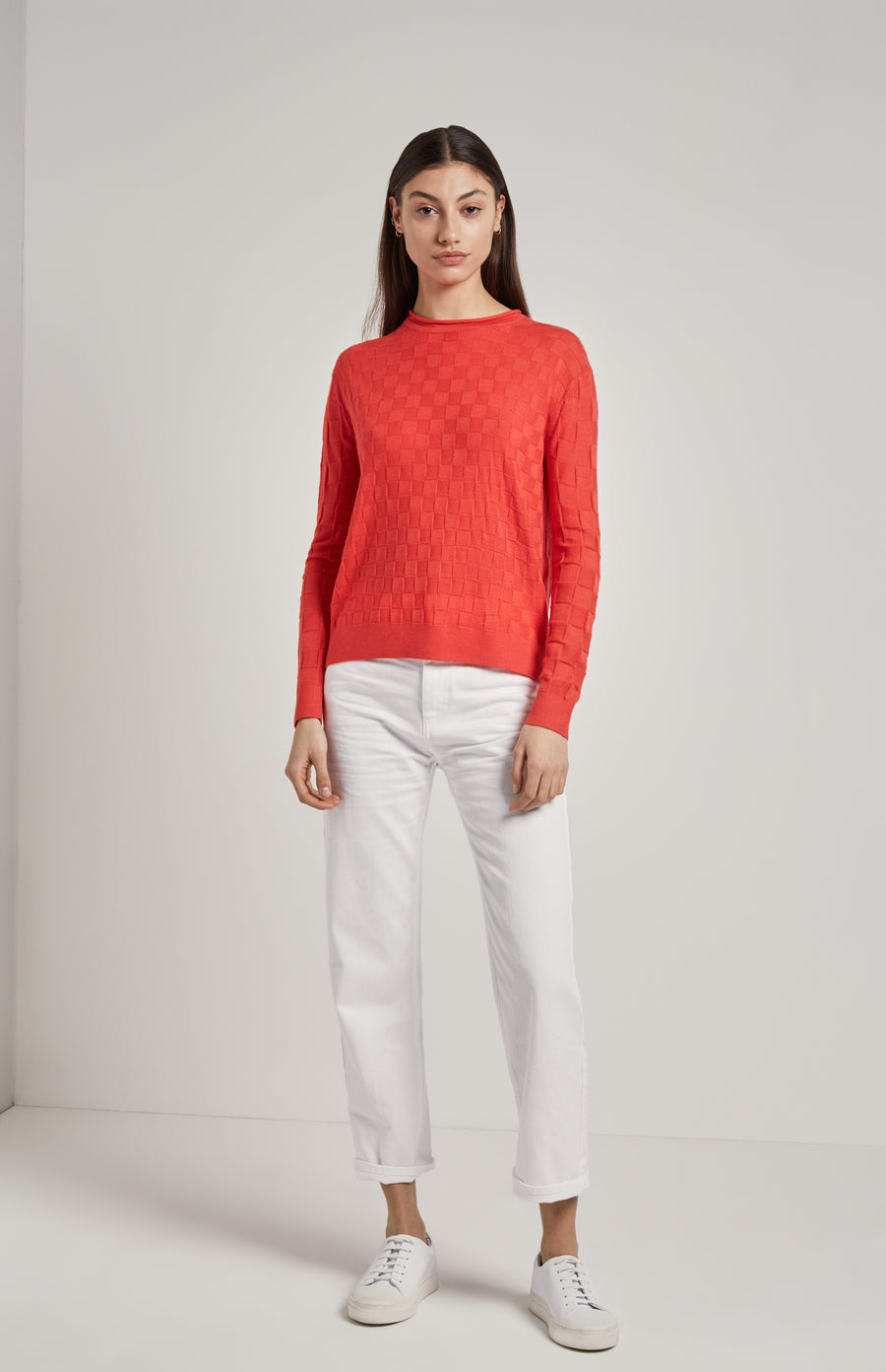 Knitted 3D Check Jumper In Coral on model - Pringle of Scotland