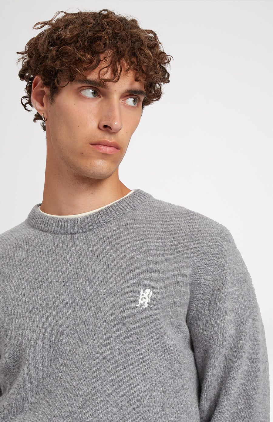 Round Neck Lambswool Blend Golf Jumper In Grey Marl showing embroidery detail - Pringle of Scotland